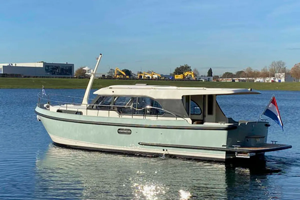 Exterior view of La Gourmandise, a Linssen Grand Sturdy 35.0 Sedan motorboat at Le Landeron, Switzerland