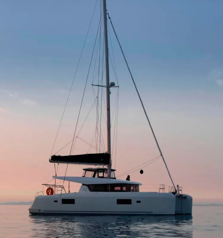 Exterior view of Genista II, a Lagoon 42 catamaran at Sant Antoni de Portmany, Spain