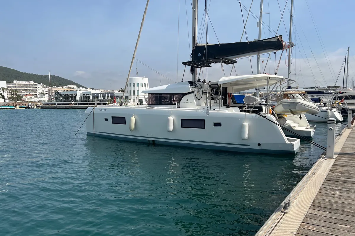 Exterior view of Genista II, a Lagoon 42 catamaran at Sant Antoni de Portmany, Spain