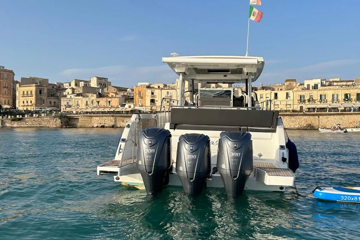 Exterior view of Ansimaste, a Jeanneau Cap Camarat 12.5 motorboat at Syracuse, Italy