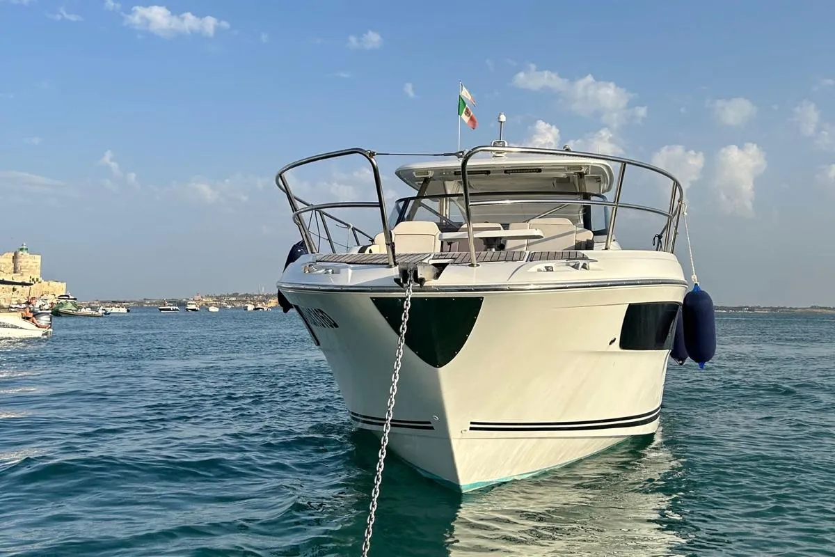 Exterior view of Ansimaste, a Jeanneau Cap Camarat 12.5 motorboat at Syracuse, Italy