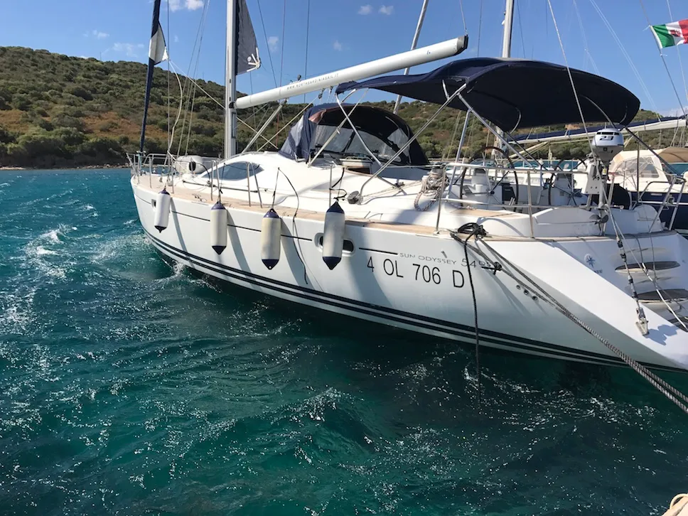 Exterior view of Cassiopea II, a Jeanneau Sun Odyssey 54DS sailboat at Olbia, Italy