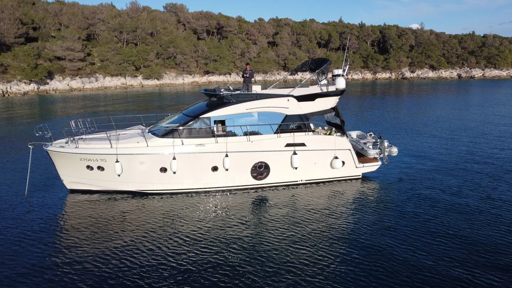 Exterior view of Sundowner, a Beneteau Monte Carlo 5 motorboat at Grad Trogir, Croatia