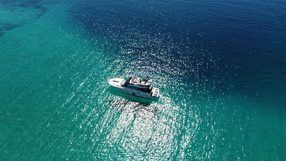 Exterior view of Sundowner, a Beneteau Monte Carlo 5 motorboat at Grad Trogir, Croatia