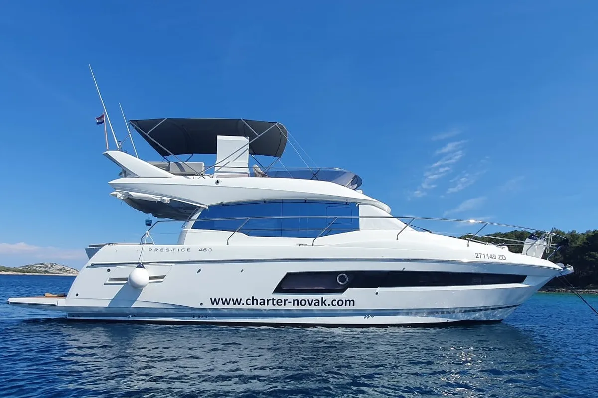 Exterior view of Ferus, a Jeanneau Prestige 460 Fly motor yacht at Grad Biograd na Moru, Croatia