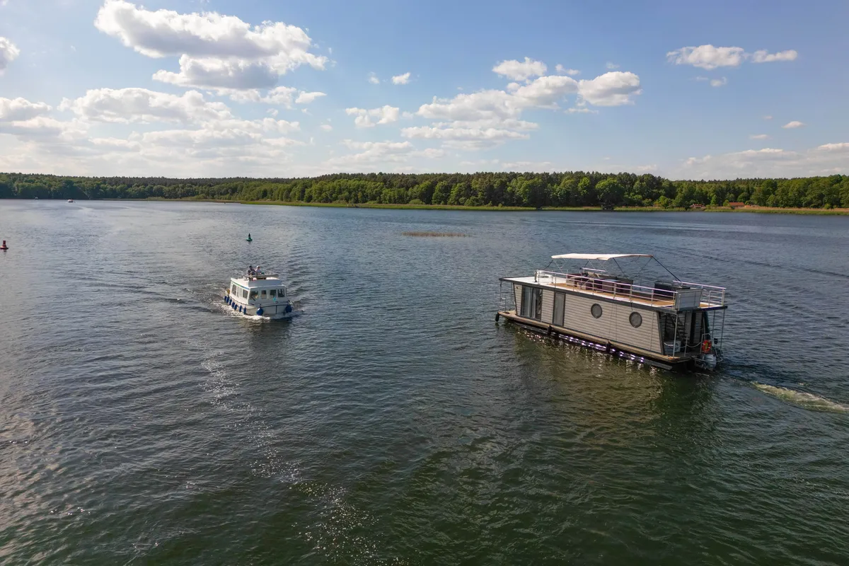 Exterior view of Miami, a Woma D13 motorboat at Fürstenberg/Havel, Germany
