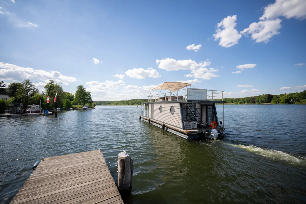 Exterior view of Miami, a Woma D13 motorboat at Fürstenberg/Havel, Germany