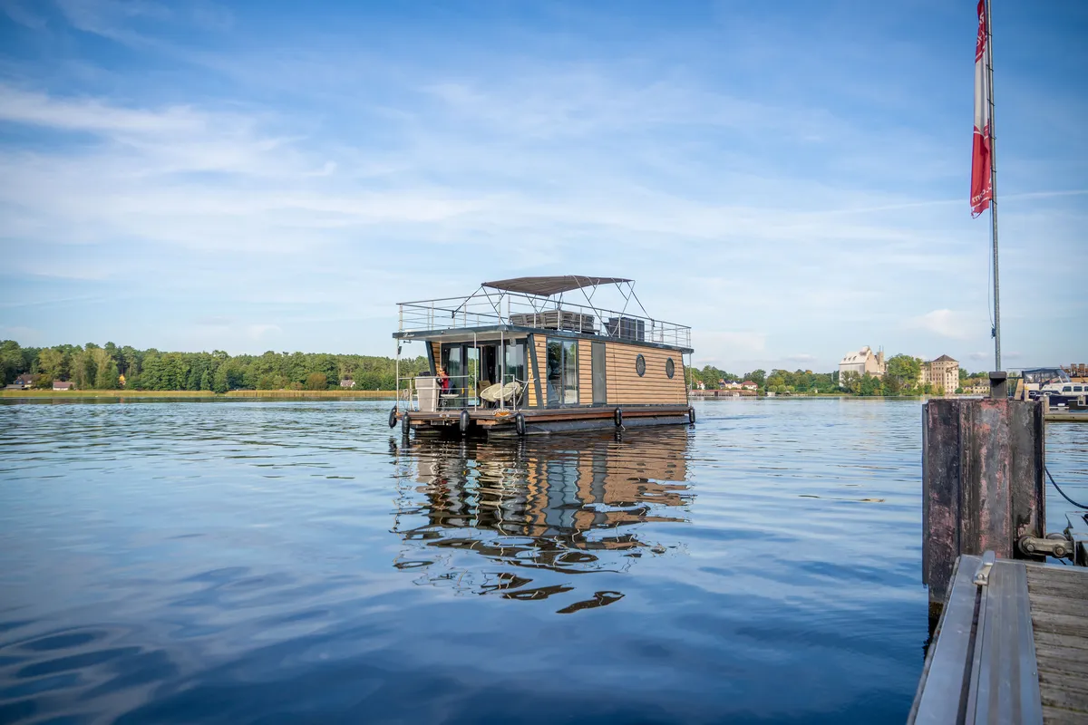 Exterior view of Miami, a Woma D13 motorboat at Fürstenberg/Havel, Germany