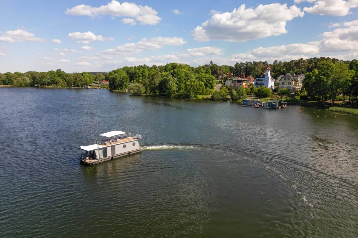 Exterior view of Miami, a Woma D13 motorboat at Fürstenberg/Havel, Germany