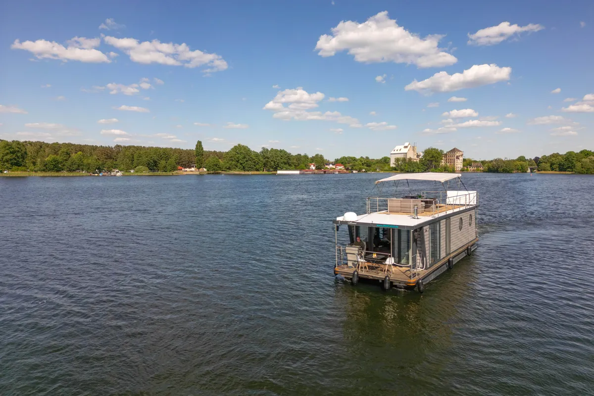 Exterior view of Miami, a Woma D13 motorboat at Fürstenberg/Havel, Germany