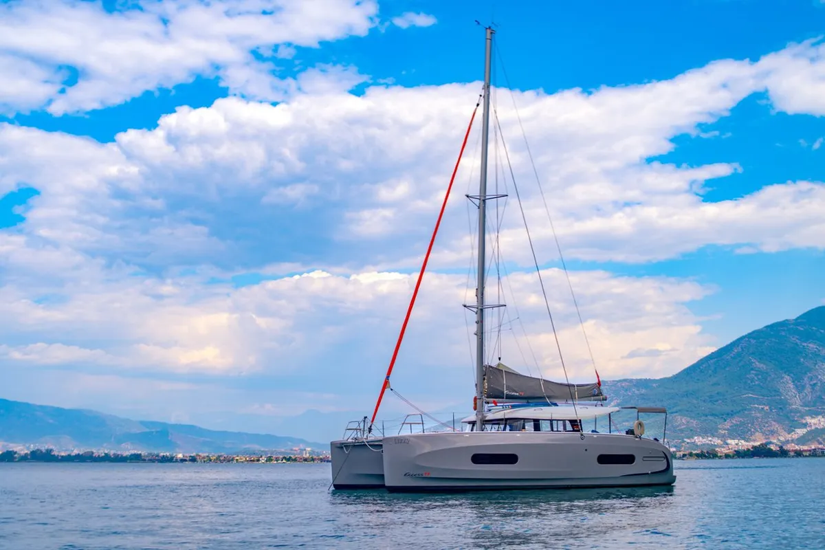 Exterior view of Lizzy, a Excess 11 - 4 + 1 + 1 cab. catamaran at Fethiye, Turkey
