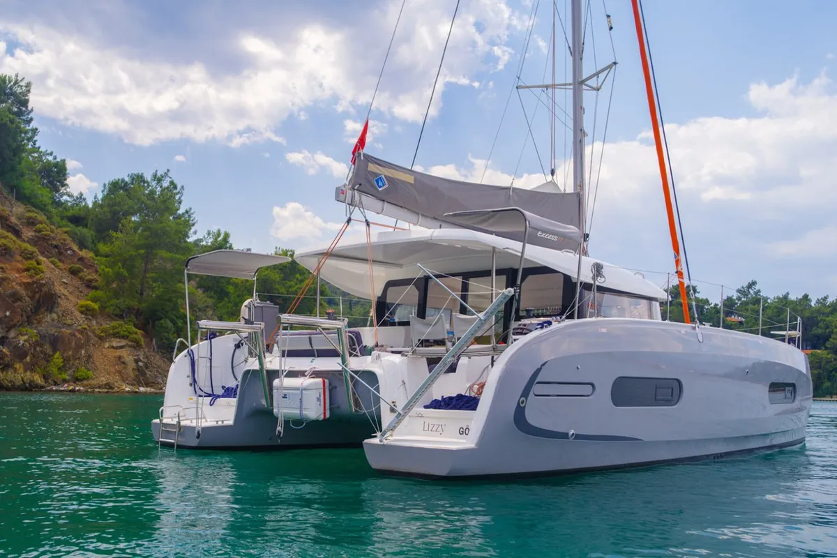 Exterior view of Lizzy, a Excess 11 - 4 + 1 + 1 cab. catamaran at Fethiye, Turkey