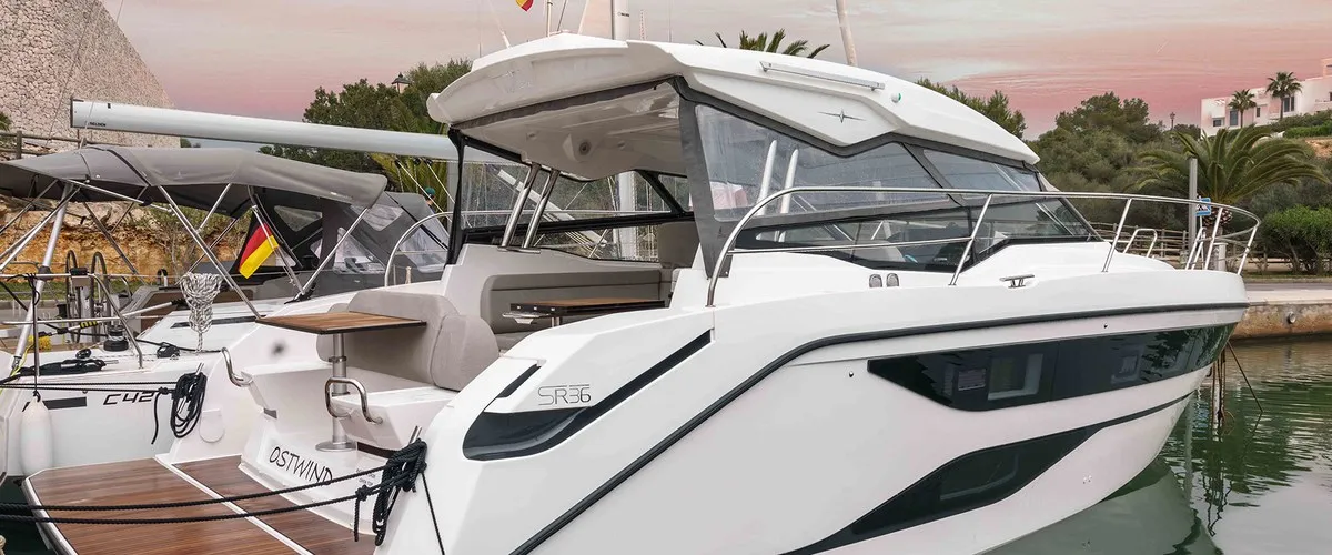 Exterior view of Ostwind, a Bavaria SR36 Open Top motor yacht at Cala Egos, Spain