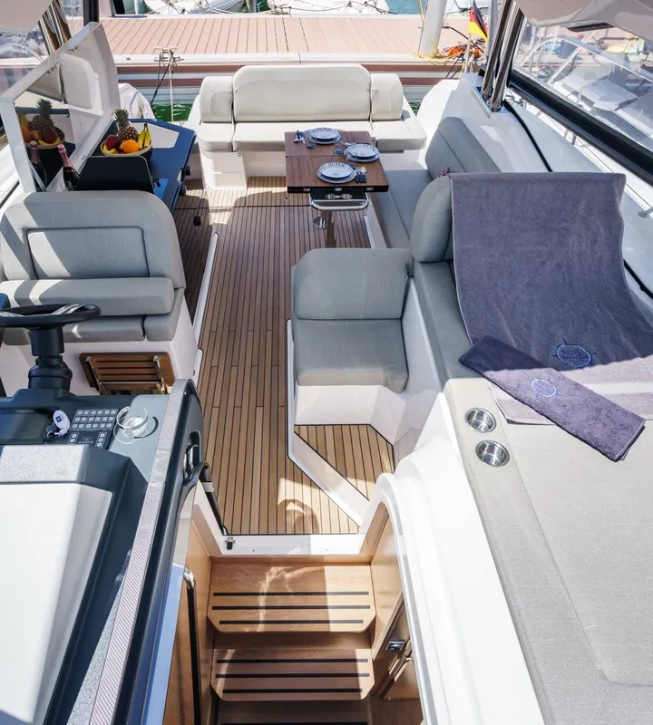 Deck of Ostwind, a Bavaria SR36 Open Top motor yacht at Cala Egos, Spain