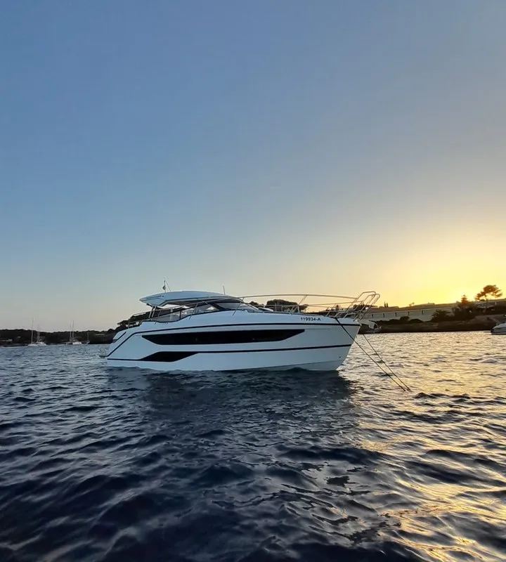 Exterior view of Ostwind, a Bavaria SR36 Open Top motor yacht at Cala Egos, Spain