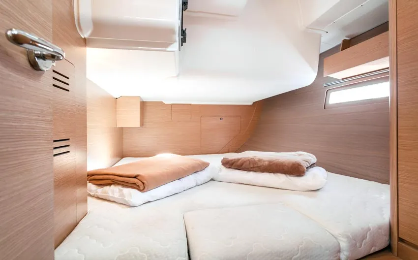 Cabin on Gavi, a Dufour 412 Grand large sailboat at Olbia, Italy