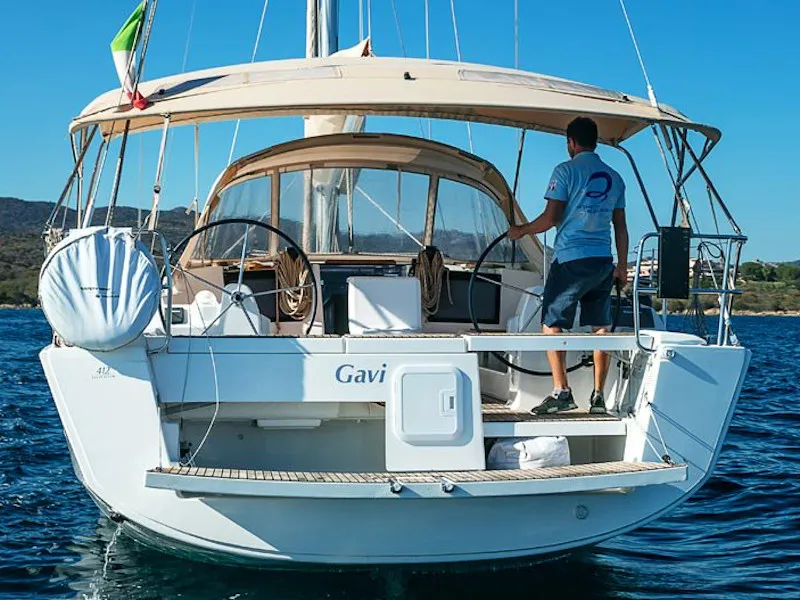 Exterior view of Gavi, a Dufour 412 Grand large sailboat at Olbia, Italy
