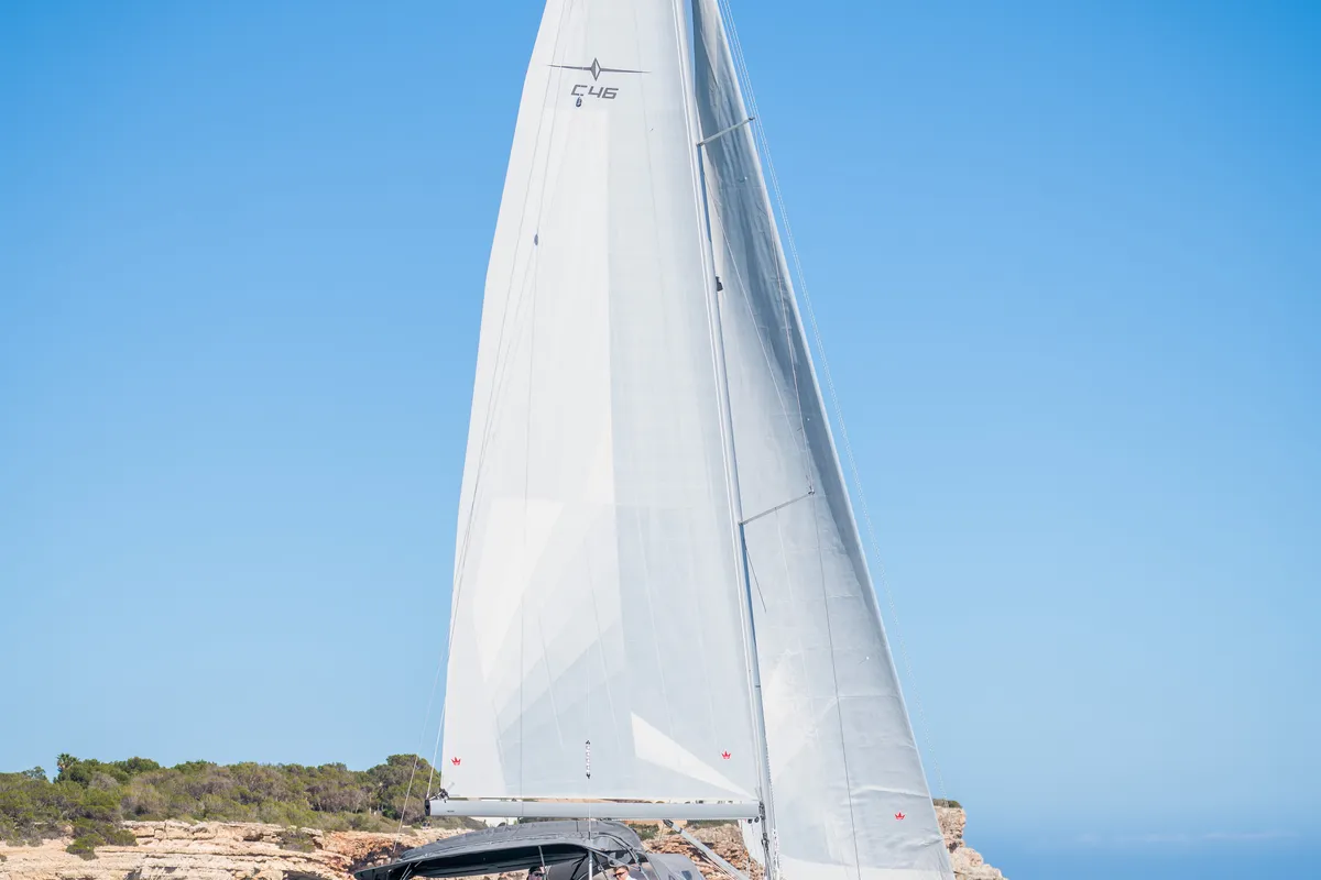 Exterior view of Ostwind III, a Bavaria C46 sailboat at Cala Egos, Spain