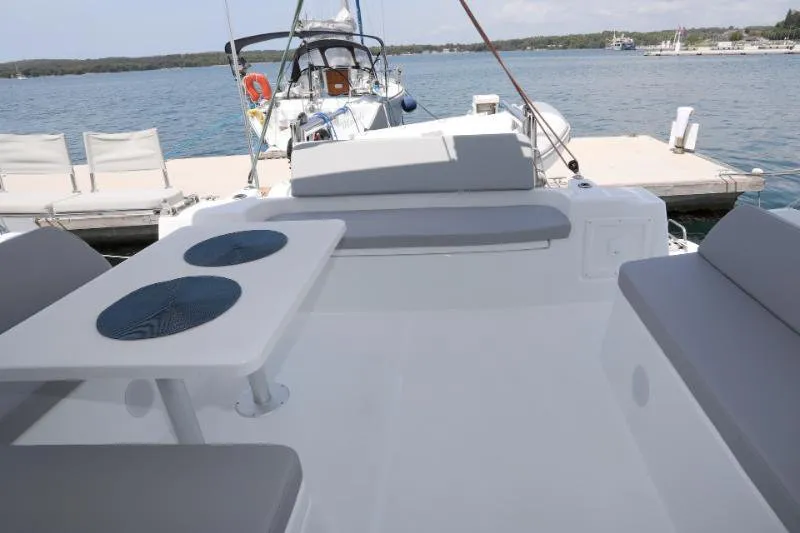 Deck of Gold Kiss, a Excess 11 - 4 + 1 + 1 cab. catamaran at Split, Croatia