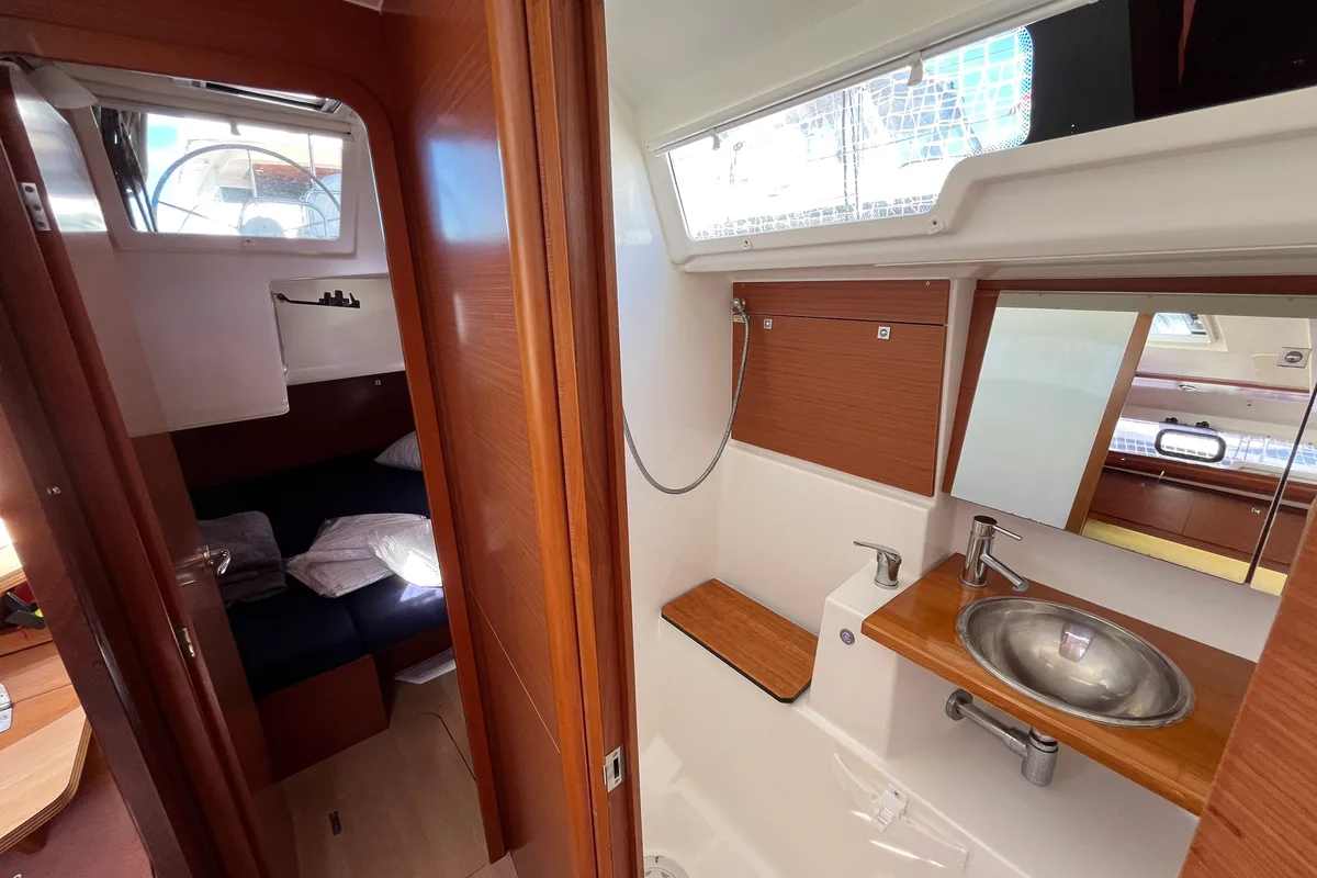 Head on Domi, a Dufour 412 Grand large sailboat at Olbia, Italy