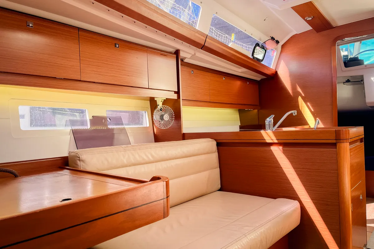 Salon of Domi, a Dufour 412 Grand large sailboat at Olbia, Italy