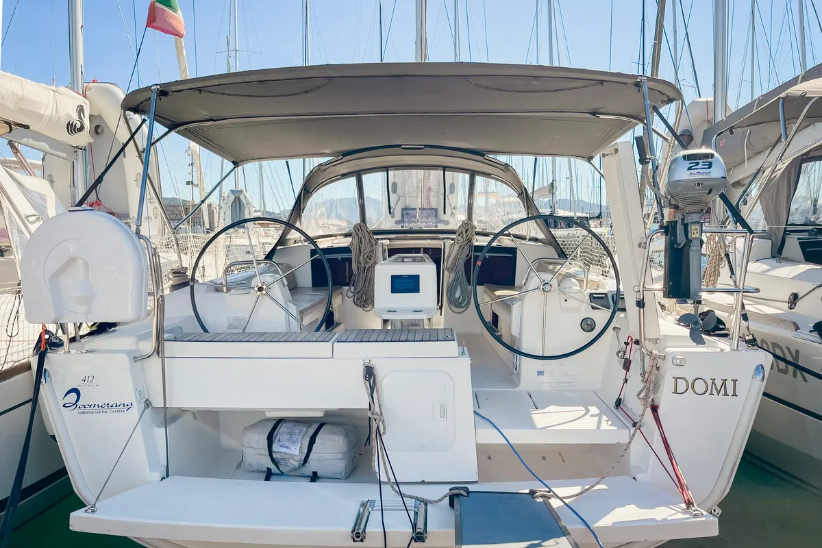 Exterior view of Domi, a Dufour 412 Grand large sailboat at Olbia, Italy