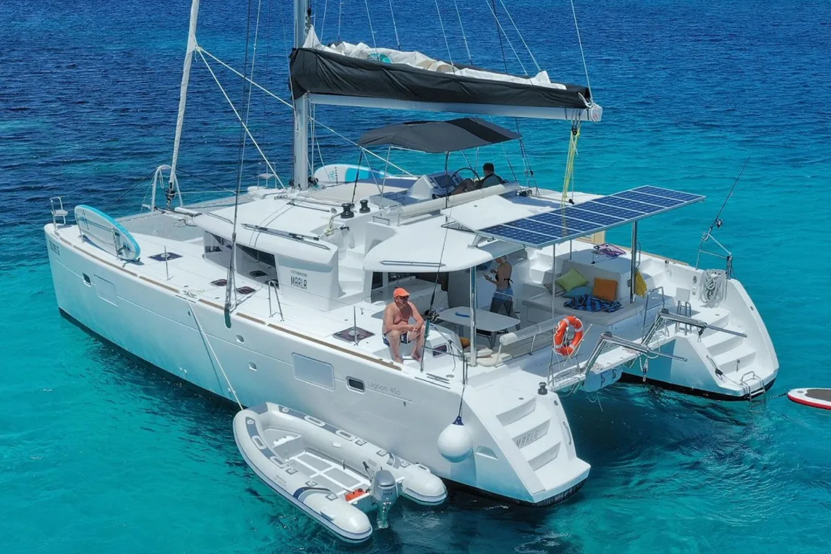 Exterior view of Oneno, a Lagoon 450 Fly catamaran at Sant Antoni de Portmany, Spain