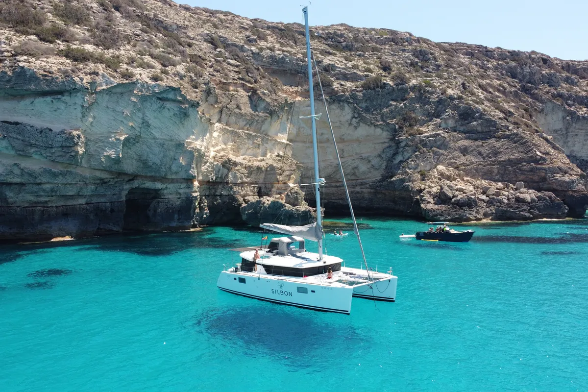 Exterior view of Gran Azul, a Lagoon 450 catamaran at Santa Eulària des Riu, Spain