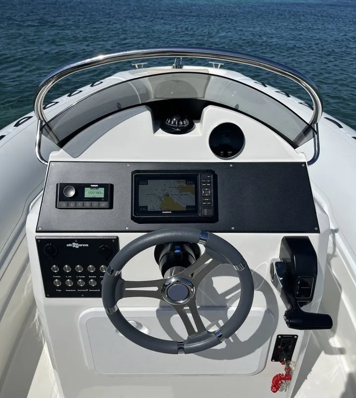 NN, a Altamarea Wave 23 Sport RIB at Cannigione, Italy
