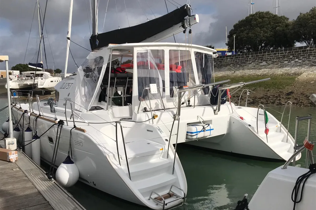 Exterior view of Naos, a Lagoon 380 catamaran at Olbia, Italy