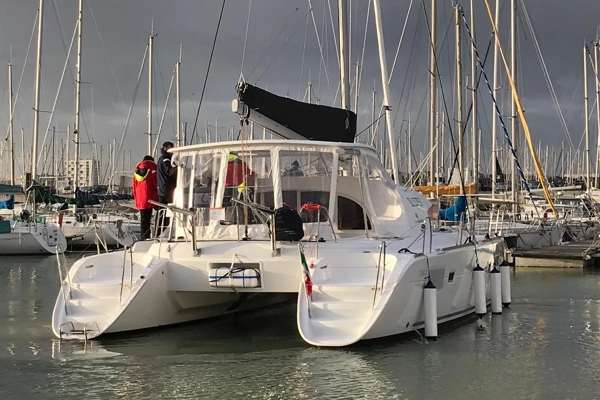 Exterior view of Naos, a Lagoon 380 catamaran at Olbia, Italy