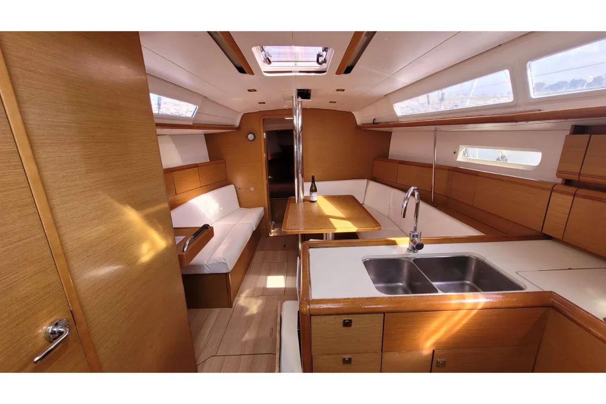 Salon of Grenat, a Jeanneau Sun Odyssey 379 sailboat at Saint-Cast-le-Guildo, France
