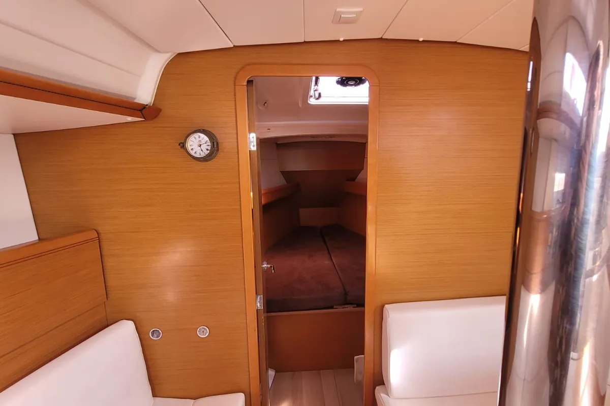 Salon of Grenat, a Jeanneau Sun Odyssey 379 sailboat at Saint-Cast-le-Guildo, France