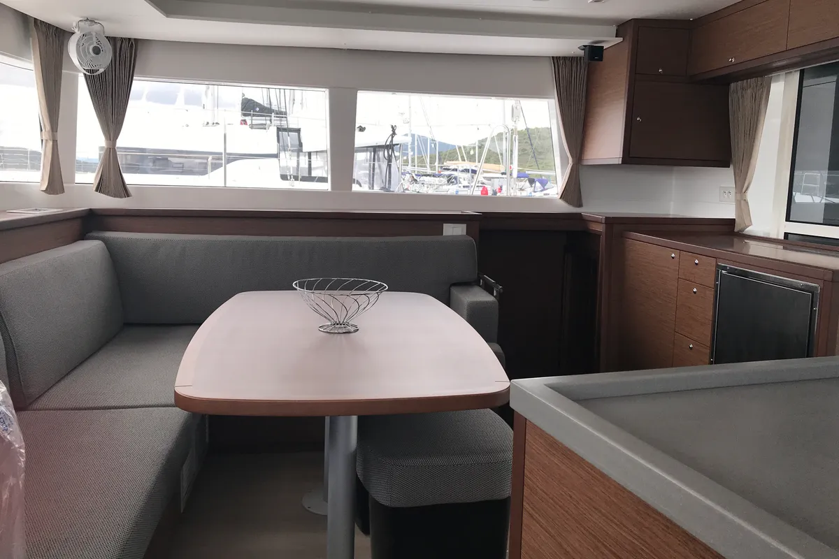 Salon of Rigel Kentaurus, a Lagoon 450 Fly catamaran at Olbia, Italy