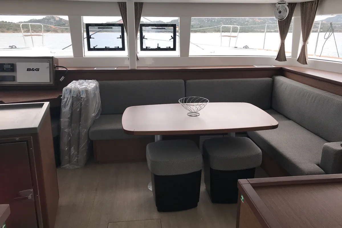 Salon of Rigel Kentaurus, a Lagoon 450 Fly catamaran at Olbia, Italy