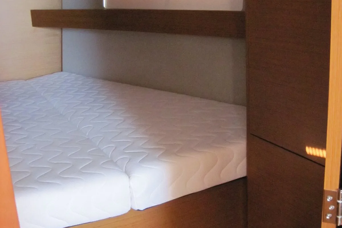 Cabin on Erminia, a Jeanneau Sun Odyssey 440 sailboat at Capo d'Orlando, Italy