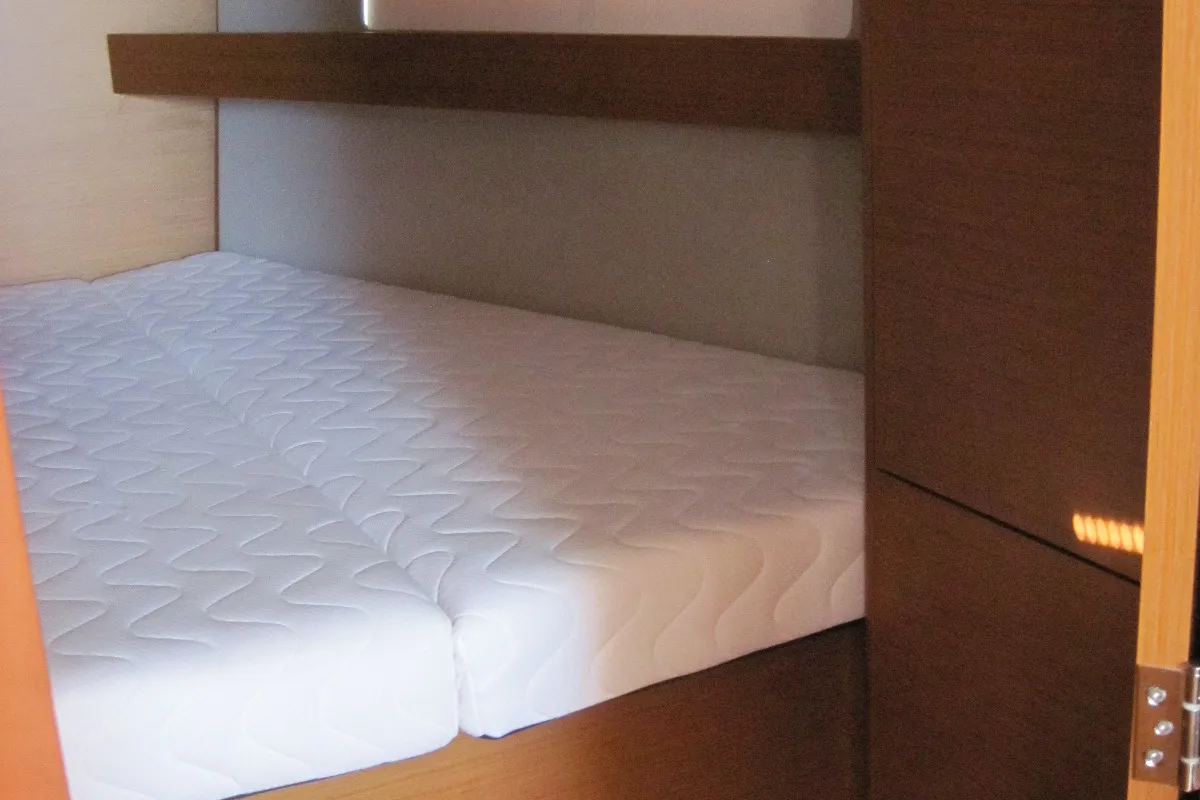 Cabin on Erminia, a Jeanneau Sun Odyssey 440 sailboat at Capo d'Orlando, Italy
