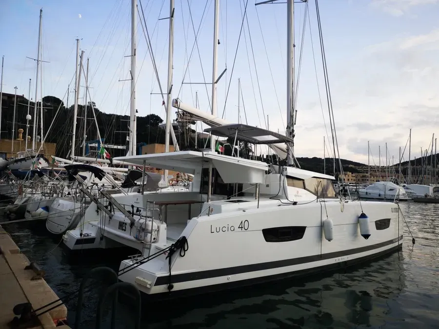 Exterior view of Ines, a Fountaine Pajot Lucia 40 catamaran at Olbia, Italy