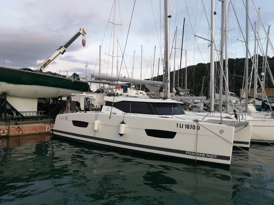 Exterior view of Ines, a Fountaine Pajot Lucia 40 catamaran at Olbia, Italy