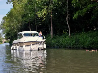 Exterior view of Cantate, a Nicols Sedan Primo motorboat at Grez-Neuville, France