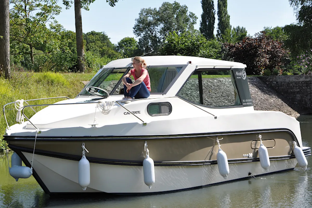 Exterior view of Cantate, a Nicols Sedan Primo motorboat at Grez-Neuville, France