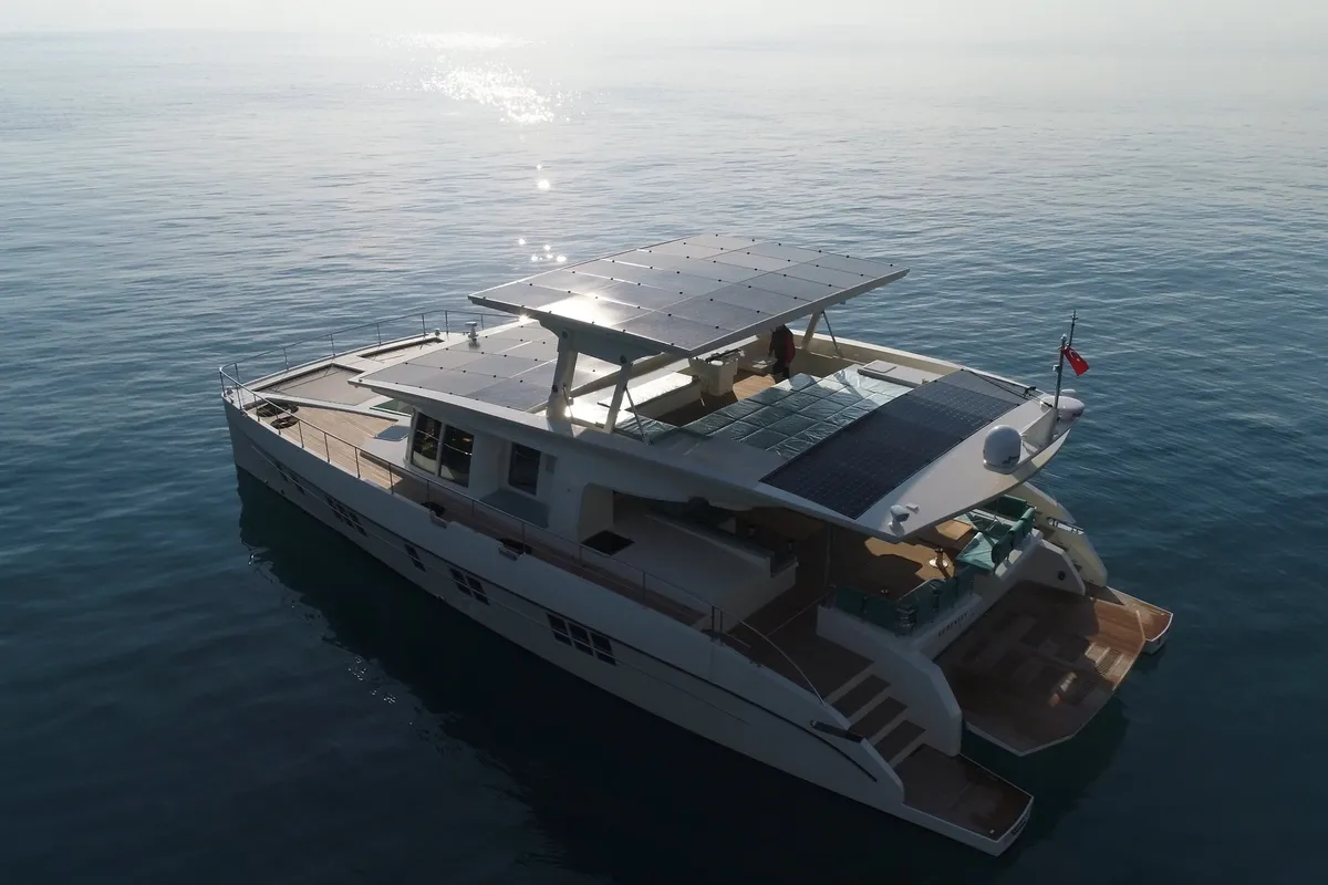 Exterior view of Premium +, a Gulet Serenity 64 catamaran at Sant Antoni de Portmany, Spain