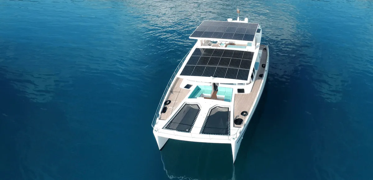 Exterior view of Premium +, a Gulet Serenity 64 catamaran at Sant Antoni de Portmany, Spain