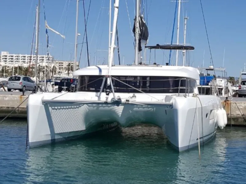 Exterior view of Mares, a Lagoon 42 catamaran at Sant Antoni de Portmany, Spain