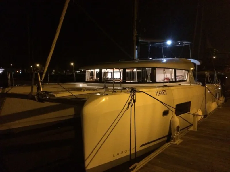 Exterior view of Mares, a Lagoon 42 catamaran at Sant Antoni de Portmany, Spain