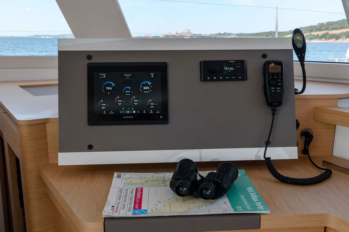 Cockpit of Agitation - A/C, Generator, Water maker. Solar panel, a Fountaine Pajot Astréa 42 catamaran at Cannigione, Italy