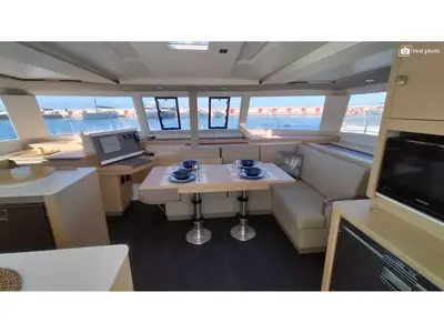 Salon of Agitation - A/C, Generator, Water maker. Solar panel, a Fountaine Pajot Astréa 42 catamaran at Cannigione, Italy