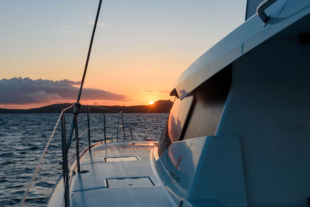 Exterior view of Agitation - A/C, Generator, Water maker. Solar panel, a Fountaine Pajot Astréa 42 catamaran at Cannigione,…