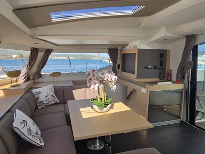 Salon of Ruinart, a Fountaine Pajot Elba 45 catamaran at Olbia, Italy