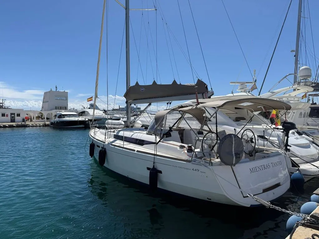 Exterior view of Mientras Tanto, a Jeanneau Sun Odyssey 449 sailboat at Ibiza, Spain